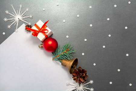2021 New Year Christmas decorations flatlay. Gift box red ball spruce branch pinecone bell...