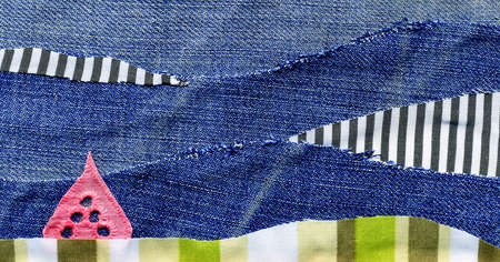 Fabric art applique Illustration. Patchwork forest landscape with trees, hills and sky. Original graphic illustration with jeans striped fabric flaps. Decorative landscape hand made recycled trash artの写真素材