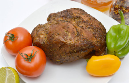 Baked meat with vegetables on the platter.の写真素材