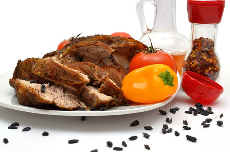 Grilled meat on a plate with vegetables and barberry.の写真素材