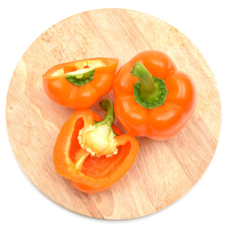 Bell peppers on chopping boardの写真素材