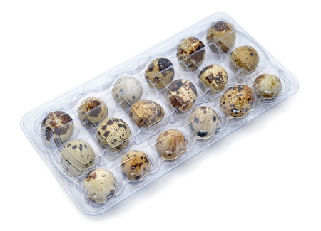 18 quail eggs in their plastic packagingの写真素材