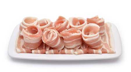 Rolled bacon on the plate. Top viewの写真素材