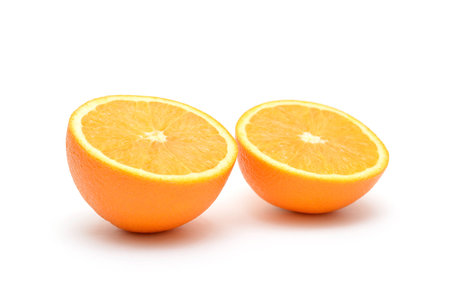 Two pieces of orange isolated on whiteの写真素材
