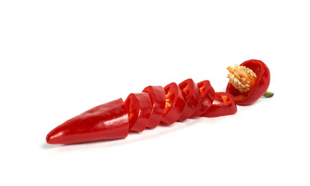 Chili peppers isolated on a white background. Hot red chili peppers sliced acrossの写真素材