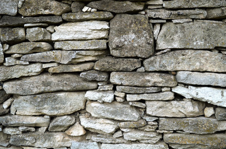 Old stone wall texture backgroundの写真素材