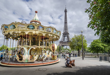 Carousel in Paris with the Eiffel Tower in the backgroundのeditorial素材
