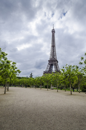 Eiffel Tower with trees and walkway  in the foregroundの写真素材