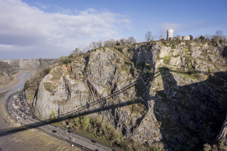 Clifton Observatory, on top of the cliff with silhouette of bridge and River Avon in the valley, Clifton, Bristol, Englandのeditorial素材