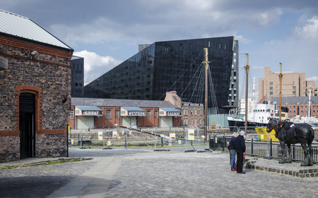 LIVERPOOL UK, MAY 6 2012: The old Great Western Railway warehouse with black modern building behind it, Liverpool UKのeditorial素材