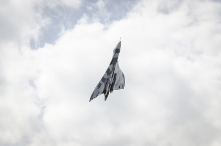 HEADCORN, KENT, ENGLAND - 15 AUGUST 2015: Avro Vulcan XH558 circles the Kent countryside on August 15, 2015 The V-Force Tour. XH558 Avro Vulcan was the world's last flying Vulcan.のeditorial素材