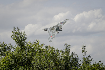 HEADCORN, KENT, ENGLAND - 15 AUGUST 2015: Avro Vulcan XH558 circles the Kent countryside on August 15, 2015 The V-Force Tour. XH558 Avro Vulcan was the world's last flying Vulcan.のeditorial素材