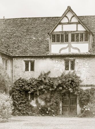 Corner of the Tudor courtyard in Lacock Abbey, Wiltshire, UK, in sepia toneのeditorial素材