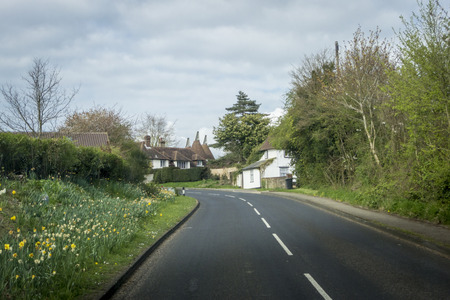 View of the street and oast houses in the High Weald area of the Kent countryside, UKの写真素材