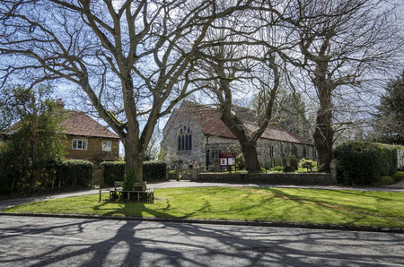 Saint George church and green int he village of Brede, Kent, UKの写真素材
