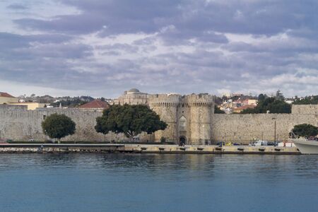 Harbour area and city Gate in the old town of Rhodes, Greece, in early morning lightのeditorial素材