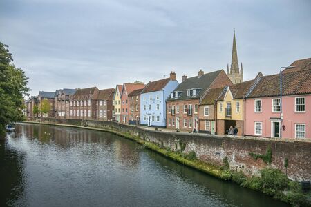 Colourful houses on the quayside of river Wensum as it flows through the city of Norwich, Norfolk, UKのeditorial素材