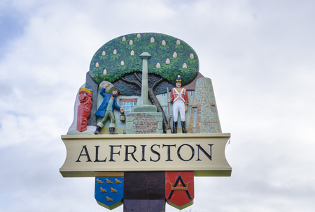 Ornate village sign of Alfriston, East Sussex, UKの写真素材