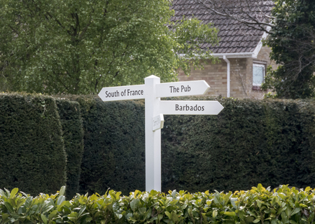 Quirky directional sign post pointing to favourite destinationsの写真素材
