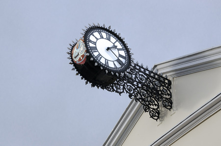 Detail of an ornate projecting clock in the Town Hall in the High Street, Hythe, Kent, UKのeditorial素材