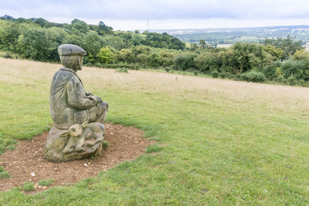 Wooden sculpture of a shepherd on the North Downs, Kent, UK. Area of outstanding natural beautyのeditorial素材