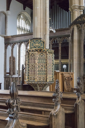 Ornate pulpit and carved wooden pew ends in the church of St Edmund, King and Martyr in the town of Southwold, Suffolk UKのeditorial素材