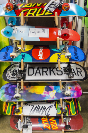 Colourful skate boards on a display stand for saleの写真素材