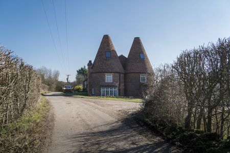 A farmhouse in the Kent countryside in Spring, UKの写真素材