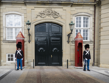Guards at the Amalienborg Palace in the city of Copenhagen, Denmarkのeditorial素材