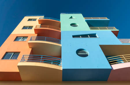 Facade of colourful modern buildings in the marina in Albufeira, Algarve, Portugalのeditorial素材