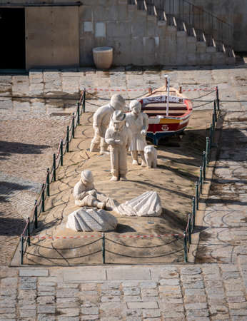 Stone statues of fishermen in Albufeira, Algarve, Portugalのeditorial素材