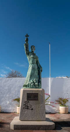 Statue of Saint Vincent of Albufeira holding a cross up high, Albufiera, Algarve, Portugalのeditorial素材
