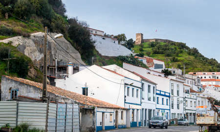 The town of Aljezur with the castle on the hill in the background, Alentejo, Algarve, Portugalのeditorial素材