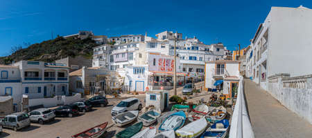 Beach in the fishing village of Burgau in the Algarve, Portugalのeditorial素材