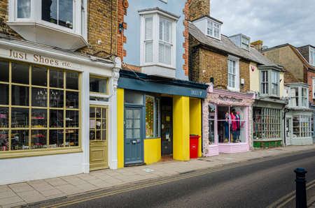 Whitsable, Kent, UK, February 2021 - Shops in Harbour Street in the seaside town of Whitstable, Kent, UKのeditorial素材