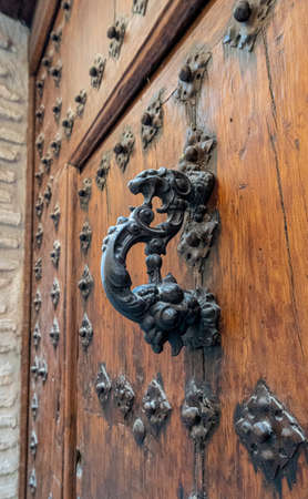 Ancient wooden door in the city of Toledo, Spainのeditorial素材