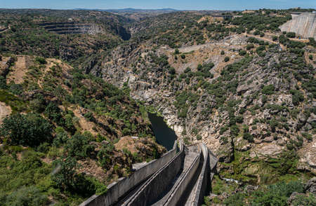 View across the valley from Almendra (Almond) Dam, also known as Villarino Dam, in Salamanca, Spainの写真素材