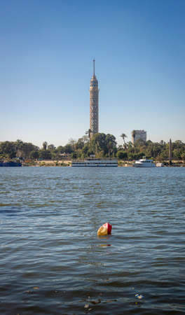 Cairo Tower and plastic polluction on the river nile in Cairo, Egyptのeditorial素材