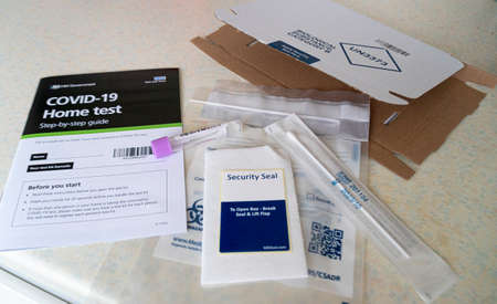 United Kingdom, March 2021 - Coronavirus Covid-19 home testing kit with swab and test tube - selective focusのeditorial素材