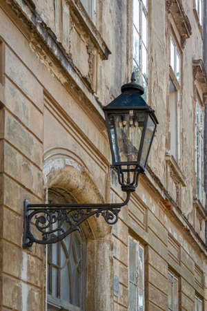 Detail of an electric street lamp on a building facade in the city of Zagreb, Croatiaの写真素材