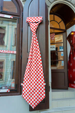 Large red and white checked tie on display in the city of Zagreb, Croatiaのeditorial素材