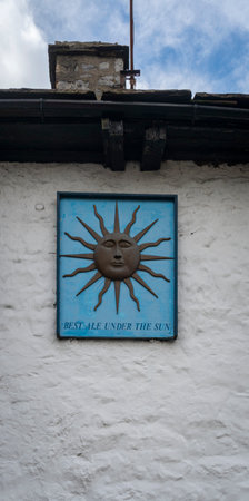 Pub Sign on the facade of a stone building in the village of Dent, Cumbria, UKのeditorial素材