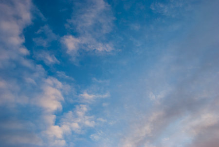 White clouds against a blue skyの写真素材