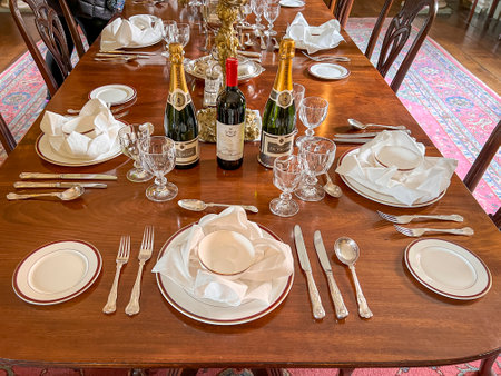 An antique dining table set for a dinner partyのeditorial素材