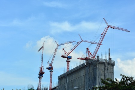 Photographs of buildings, residential buildings and a large crane to four characters together.のeditorial素材