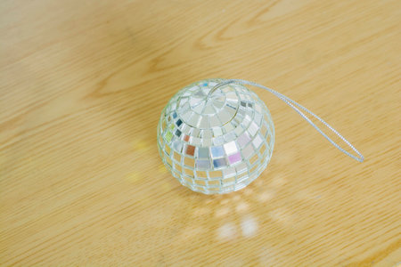 Glass balls with shiny light wood on the ground.