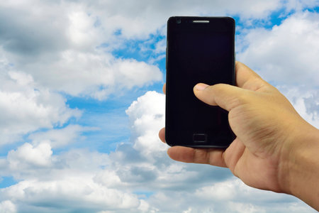 Catch mobile phone use. The backdrop is the bright sky