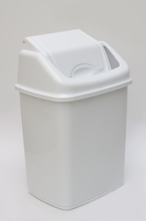 Trash bin with hinged lid on white backgroundの写真素材