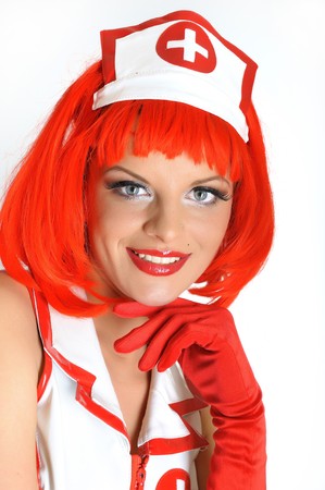 young beautiful sexy doctor in uniform and red hairの写真素材