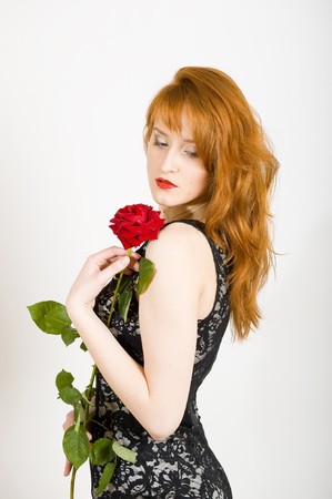 Beautiful woman with a roseの写真素材